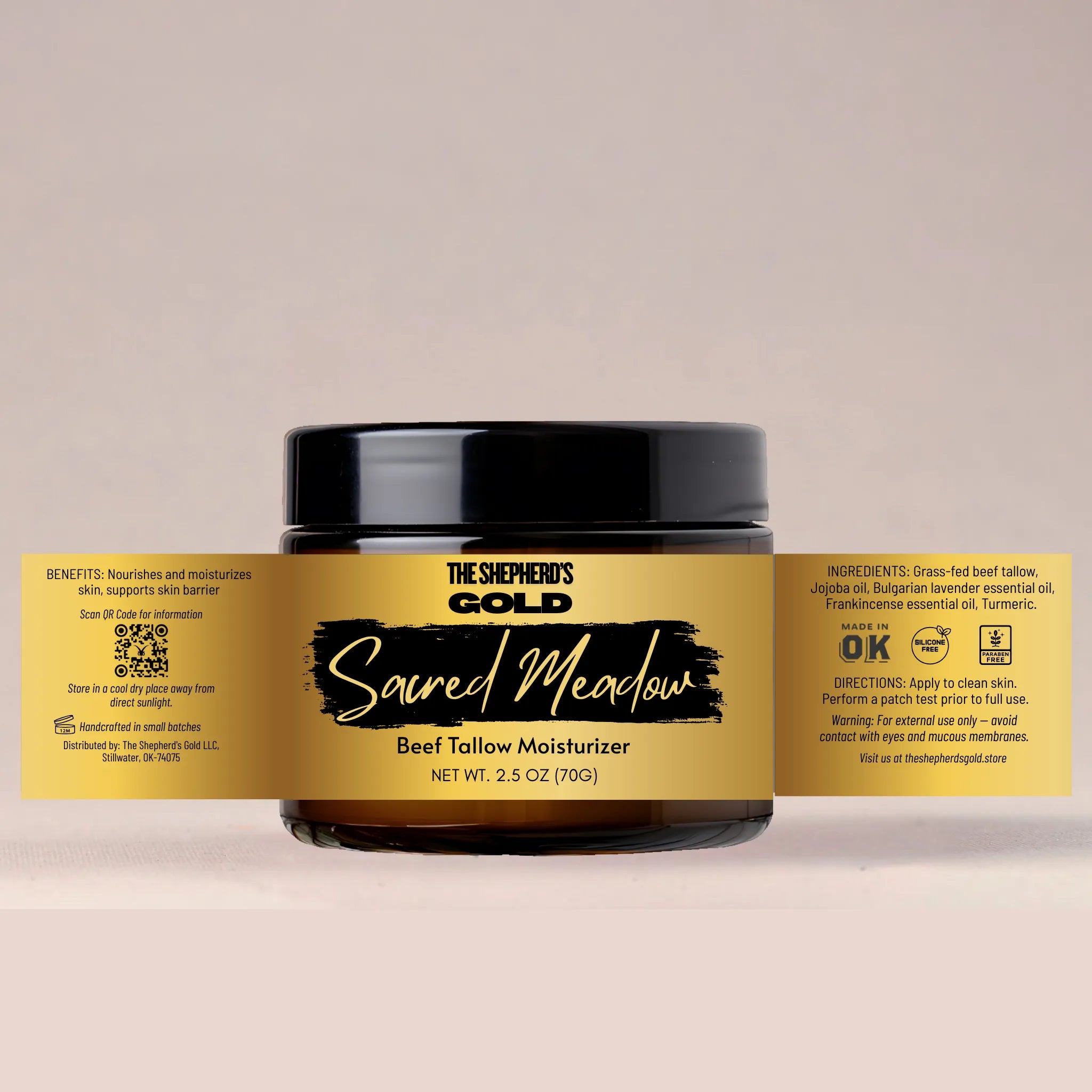 Jar of 'The Shepherd's Gold Sacred Meadow Beef Tallow Moisturizer' with a gold label on a beige background