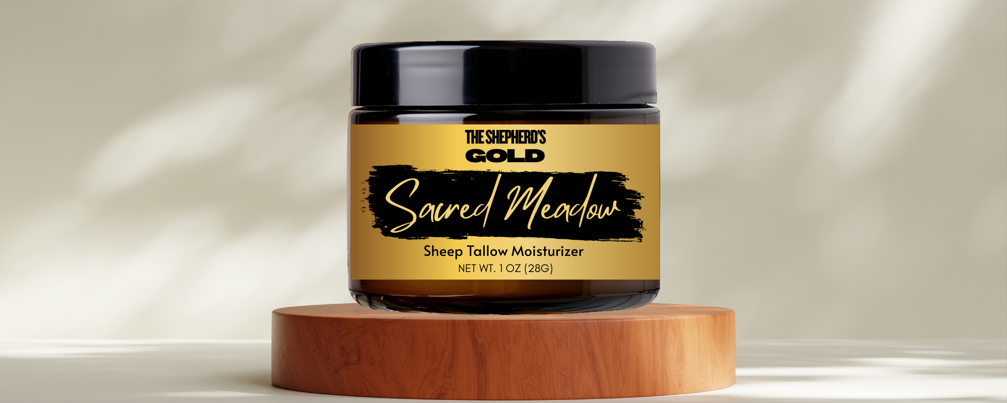 Sheep tallow moisturizer jar labeled 'The Shepherd's Gold Sacred Meadow' on a neutral background