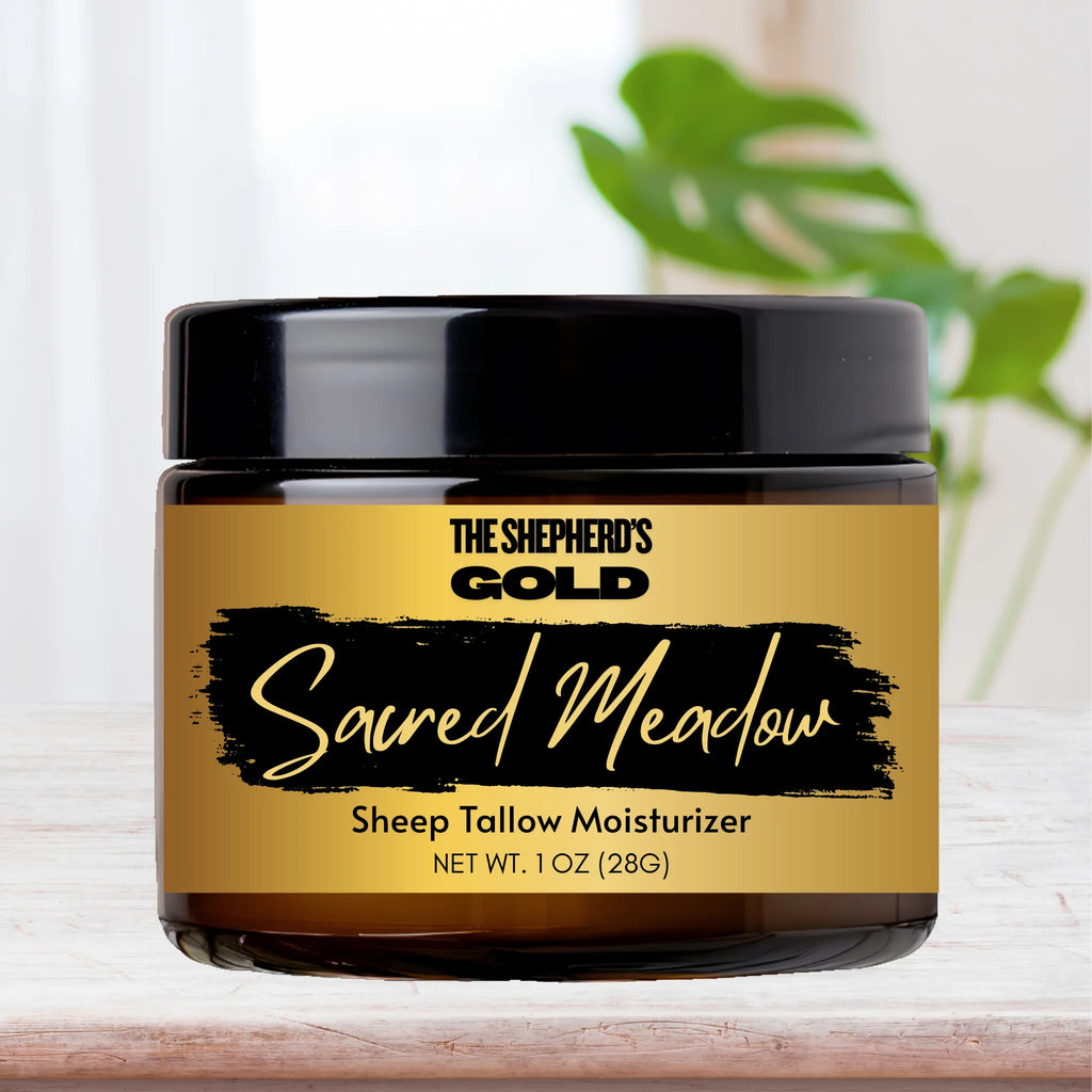 Sheep tallow moisturizer jar labeled 'The Shepherd's Gold Sacred Meadow' on a light background.